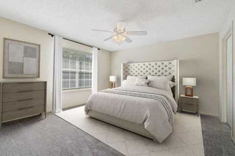 a bedroom with a bed and a ceiling fan at Baldwin Farms Apartments, Alabama